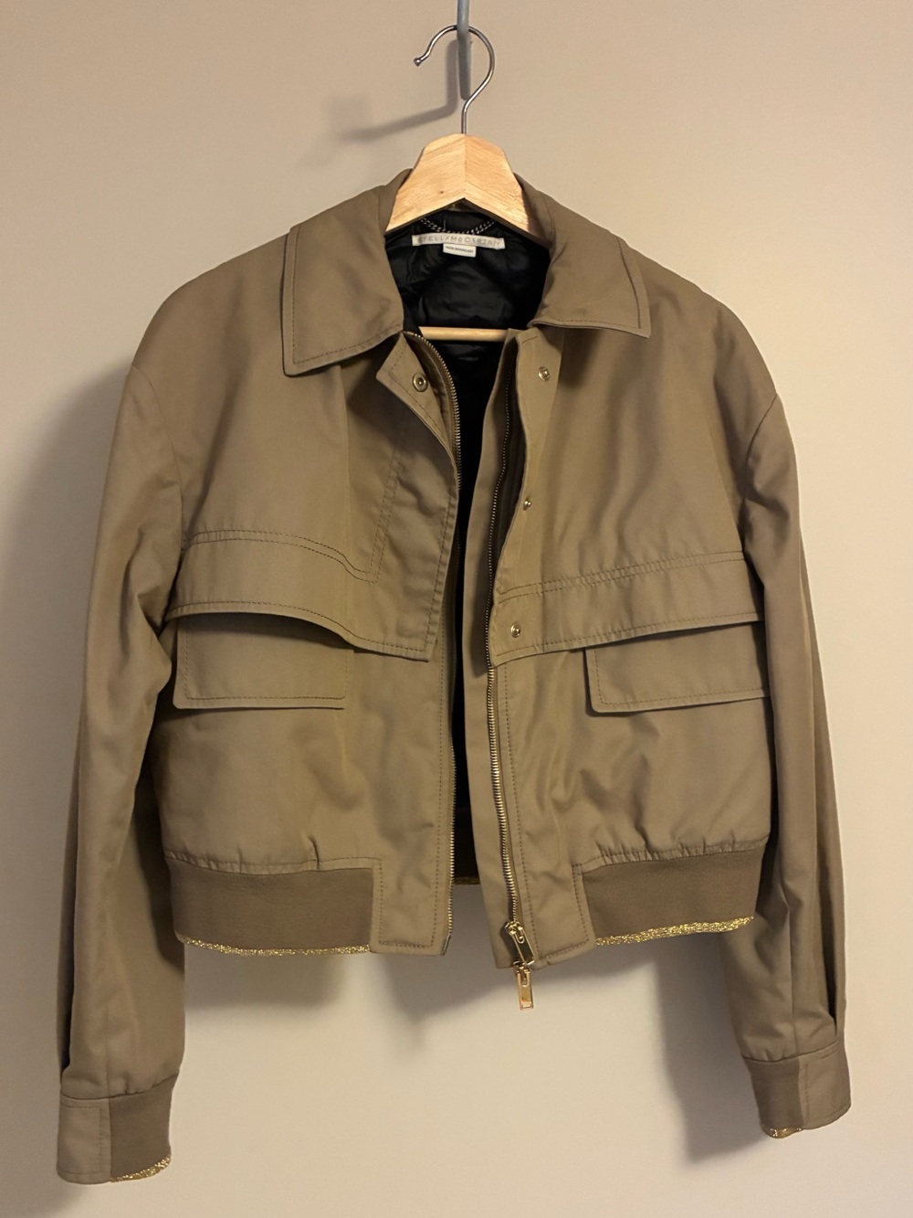 Tan zip-up collared jacket with gold trim